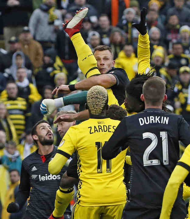 Columbus Crew SC defender Lalas Abubakar (17) tries to score off a corner kick while D.C. United goalkeeper David Ousted (1) knocks the ball away in the first half of their MLS soccer game at MAPFRE Stadium in Columbus.    (Kyle Robertson / The Columbus Dispatch)